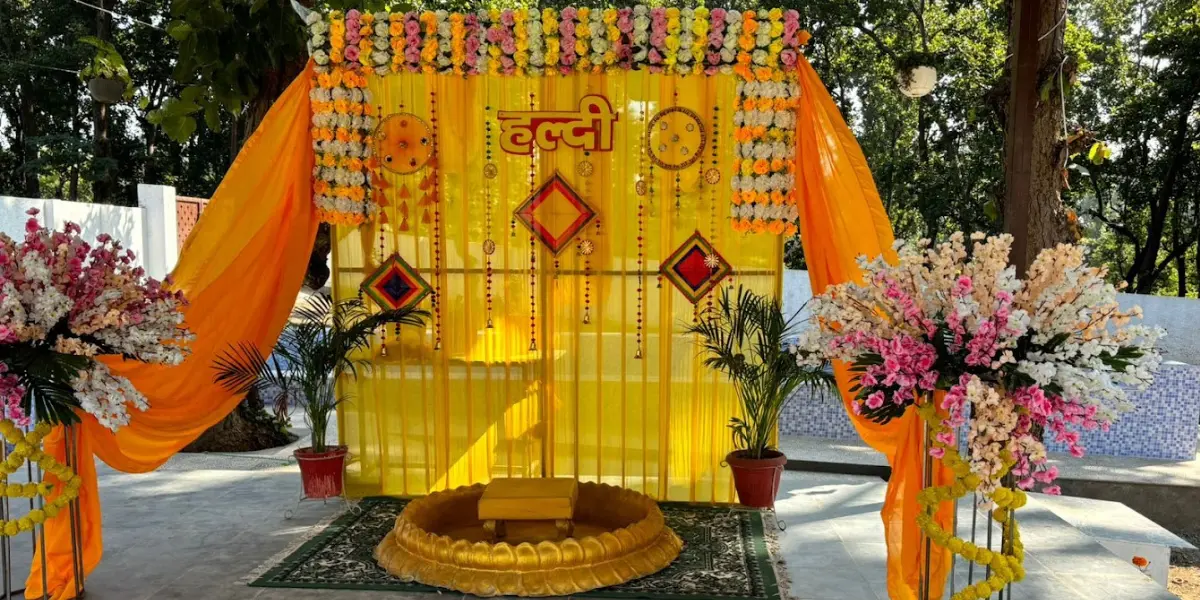 Unique Features of a Luxury Wedding Resort in Dehradun showcasing a vibrant Haldi ceremony setup with floral décor.