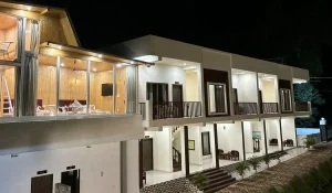 Night view of Pristine Woods Resort in Dehradun with premium cottages and balcony rooms, perfect for family stays, weddings, and luxury getaways near Sahaspur