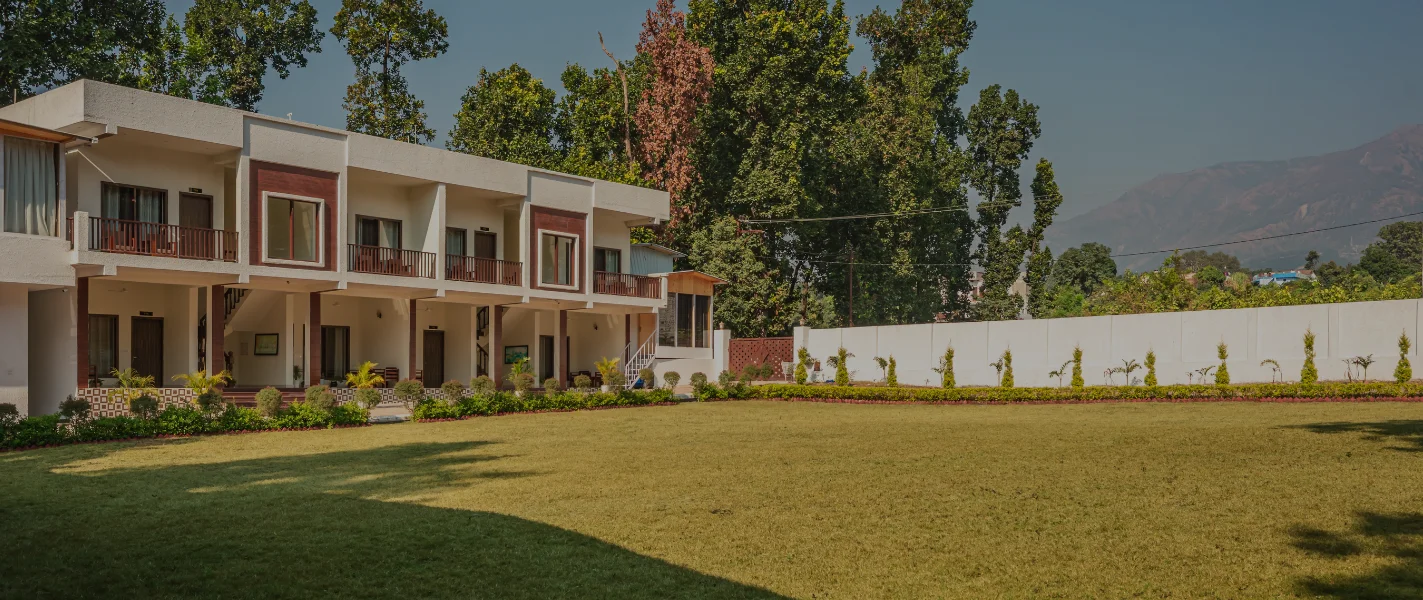 Pristine Woods Resort in Dehradun – a serene getaway surrounded by lush greenery, offering luxurious stays and a perfect setting for a refreshing day out