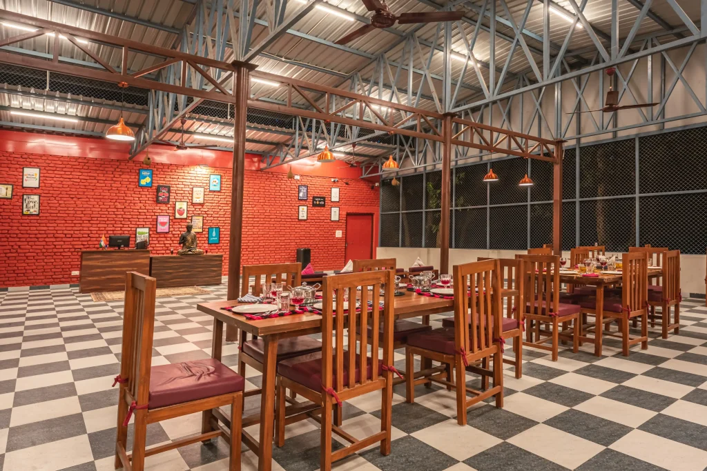 All-day dining restaurant at Pristine Woods, the best resort in Dehradun, offering buffet and à la carte meals in a warm indoor setting