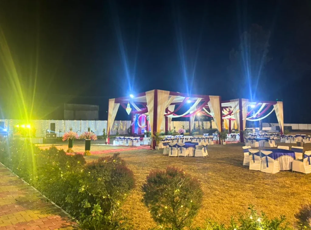 Premium wedding celebration setup at the best resort in Dehradun for wedding events featuring lawn seating and luxury lighting
