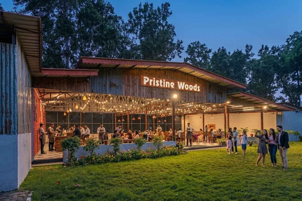 Best Corporate & Family Group Outing in Dehradun at Pristine Woods resort with open dining area, lawn gathering and evening lights